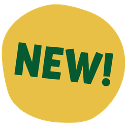 A family walk hand in hand along a paved path through a lush, leafy zoo trail with plants and trees behind them.