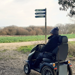 Tramper user looking at one of our interpretation boards with information about the Country Park