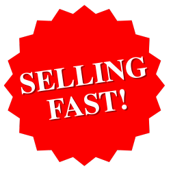 A person in a brown leather jacket and wide‑brimmed hat holds a realistic dinosaur puppet with its mouth wide open against a leafy outdoor background.