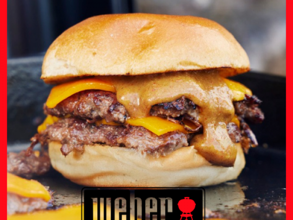 Chefs cooking at a Weber BBQ