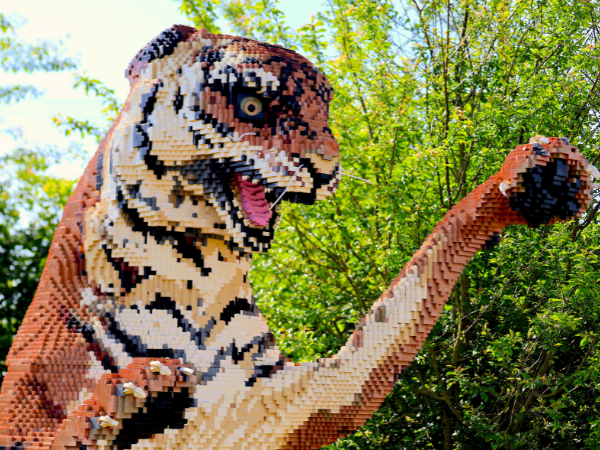 A brick-built tiger lunges towards the viewer
