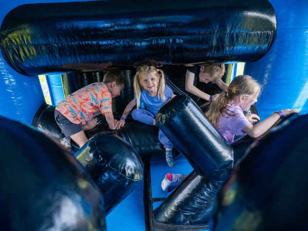 Kids enjoying the 175 inflatable at William's Den