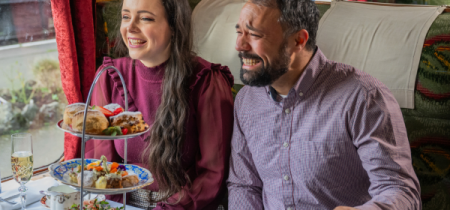 Guest enjoying an afternoon tea on-train dining experience