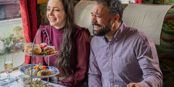 Guest enjoying an afternoon tea on-train dining experience