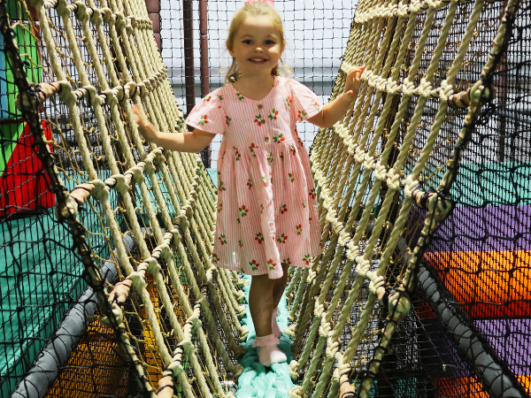 Girl playing on soft play at Brocksbushes