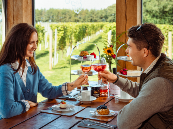 A couple enjoying afternoon tea at La Mare Wine Estate