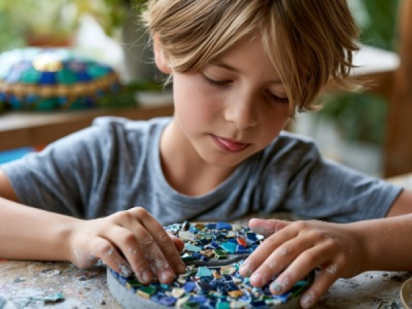 Child making mosaic art