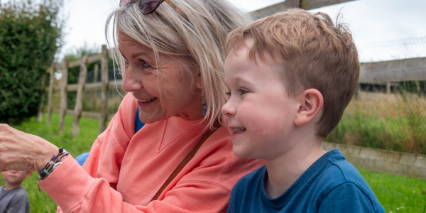 Grandmother and grandson sitting on a bench