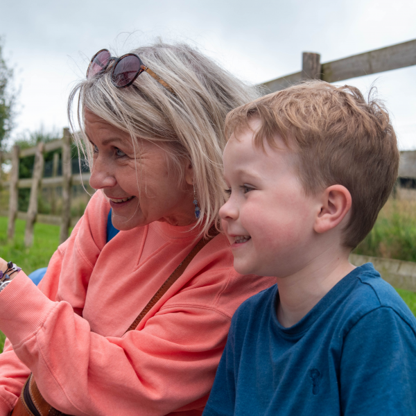 Grandmother and grandson sitting on a bench