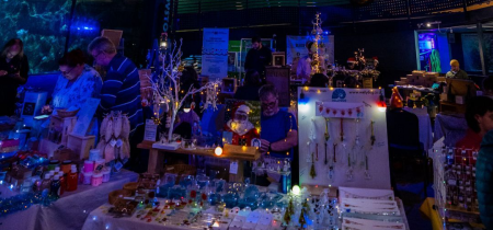 Adults at the Aquarium with Christmas Market