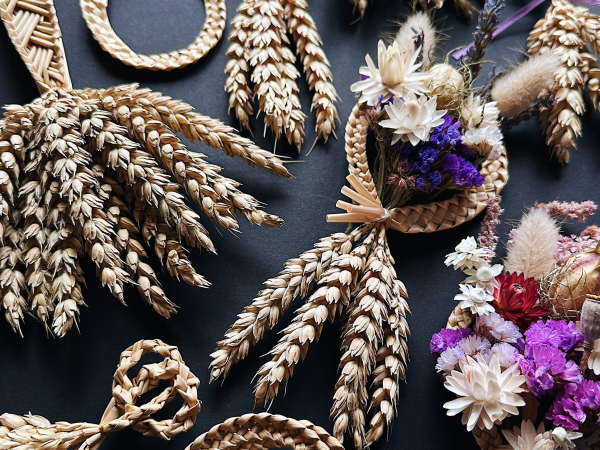 Braided Corn Dolly's presented on a table