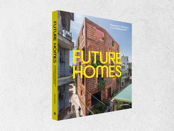 A book cover titled 'Future Homes', showing a modern urban brick building.