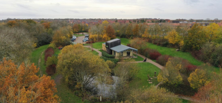 Arial view of Howe Park Wood Education Centre and autumnal woodland