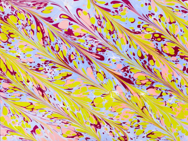 A swirling marbled paper with bright blue, pink, yellow and burgundy