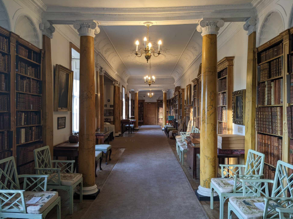 The long corridor of the Hurd Library, featuring marble effect columns