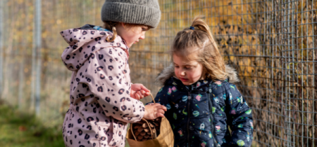 Two children with baskets along the museum's nature trail