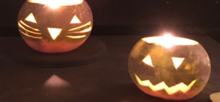 Lanterns made from carved turnips glowing with fire light