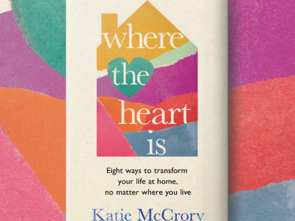 A book with a collaged house design against a colourful backgroun. It reads: Where the heart is. Eight ways to transform your life at home, no matter where you live. By Katie McCrory.