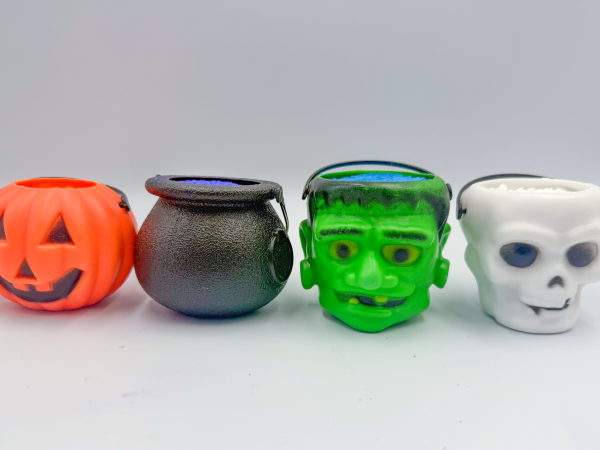 A row of Halloween themed bath bomb containers