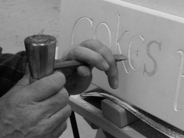 How to carve a letter in stone