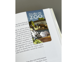 a rectangle magnetic bookmark displaying elephants in their habitat.