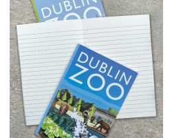 a copybook with a cover displaying the dublin zoo name and an art image of a sealion and a child.