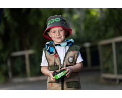 a beige childs zookeeper vest with dark green trim, four pockets and the dublin zoo logo.
