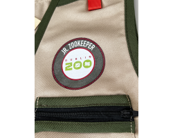 a beige childs zookeeper vest with dark green trim, four pockets and the dublin zoo logo.