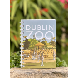 a spiral bound notebook with a cover that displays the dublin zoo name and an art image of giraffes in their habitat.