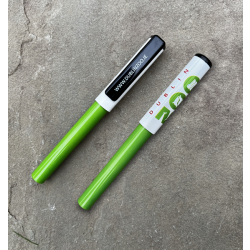 a pen with a green bottom and a white cap displaying the dublin zoo logo.