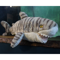 Grey fluffy shark toy with darker grey stripes and white underbelly
