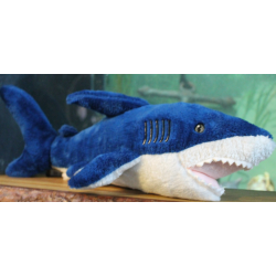Dark blue fluffy shark toy with white underside.